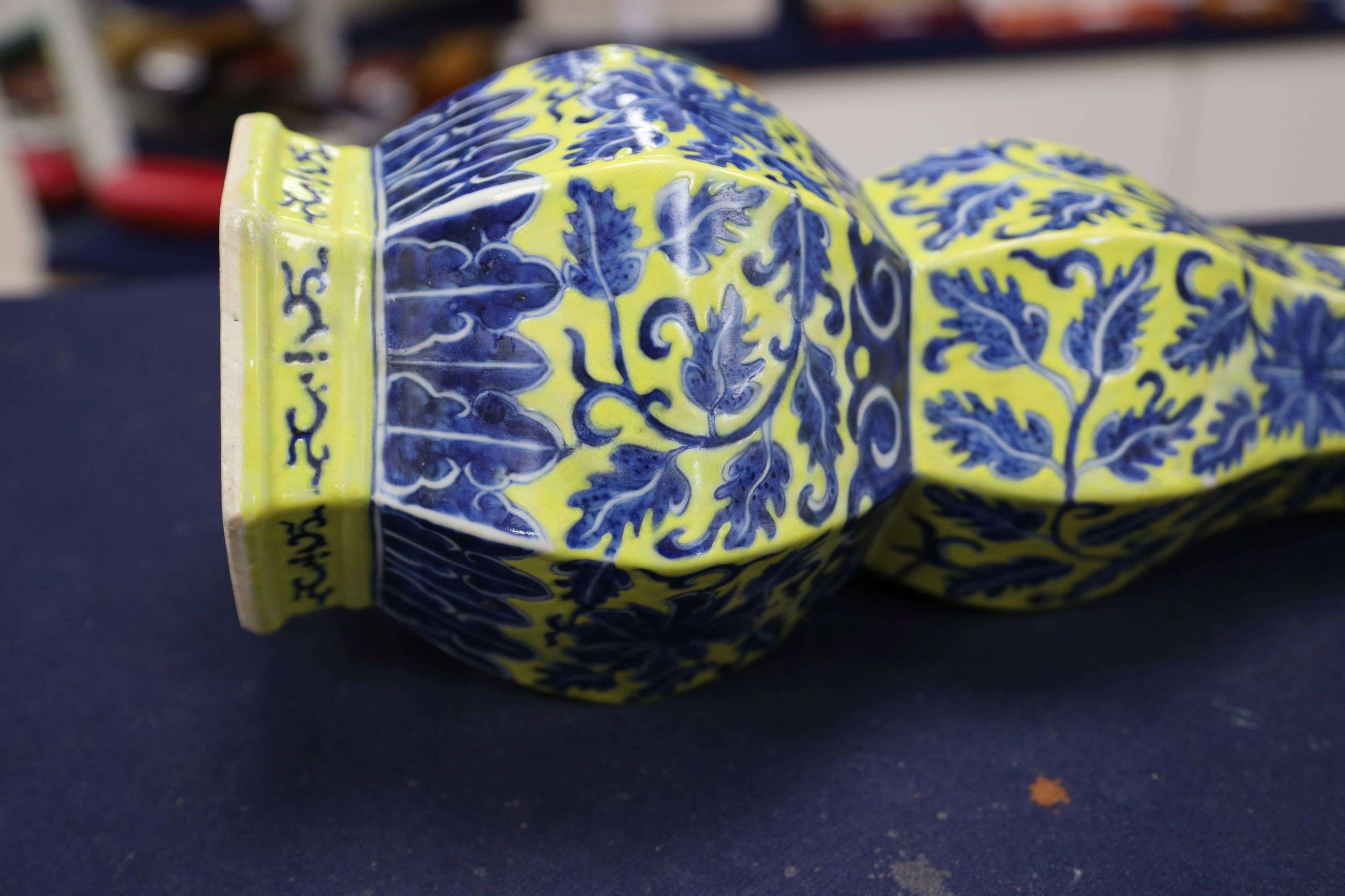 A Chinese underglaze blue yellow ground hexagonal vase, early 20th century, some restoration